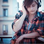 young hipster woman listening to music